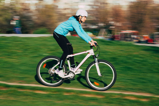 Female riding bike outdoors