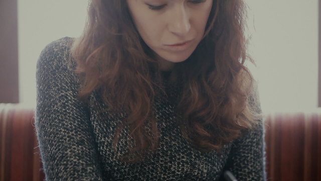  woman's hand make markings