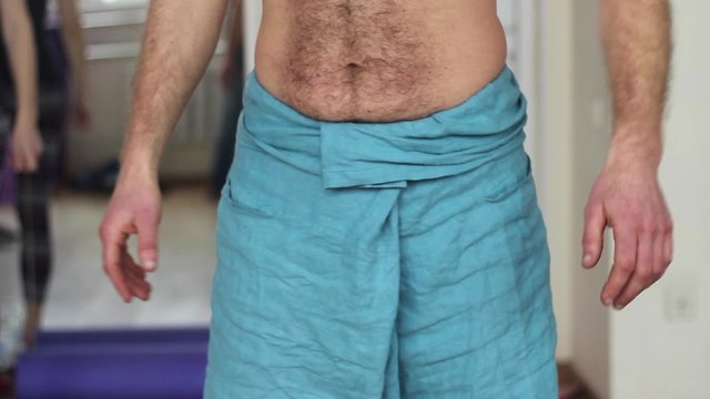 The trainer of yoga teaches men and women. Ashtanga yoga