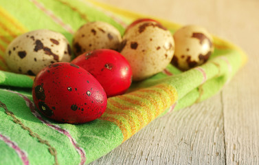 Obraz na płótnie Canvas Easter eggs on an old wooden background. Easter quail eggs
