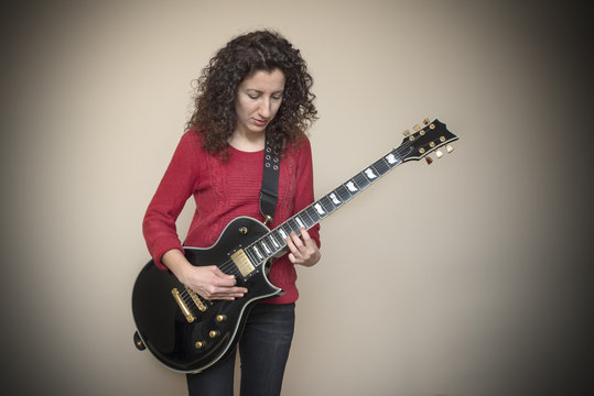 Woman Playing Electric Guitar