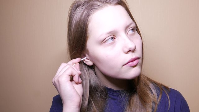 Ear cleaning with cotton swabs, 4K video