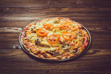 Pizza on a wooden table