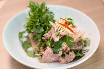 Thai sour sausage salad