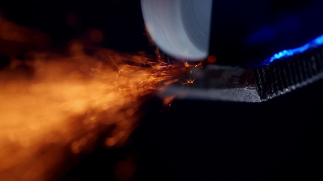 Grinding metal. Sparks frying during metal grinding.
