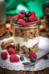 Muesli with yoghurt, raspberries and blueberrie.