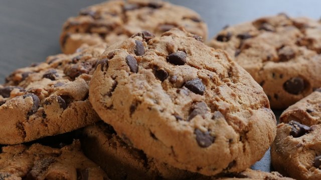 Fresh chip cake cookies with chocolate close-up tilting 4K 3840X2160 30fps UHD footage - Slow tilting on biscuit cookies arranged on table 4K 2160p UltraHD video 