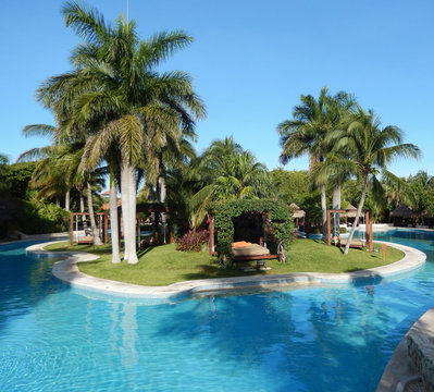 Pool amenities and landscape at a luxury tropical resort in Riviera Maya, Mexico 