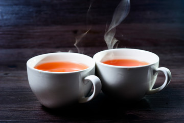 Cup of hot drink with steam.