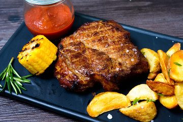 Pork steak with potatoes and vegetables
