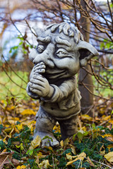 Fototapeta na wymiar Garden gnome sculpture. Garden decor.