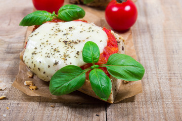 Italian bruschetta with cherry tomatoes, mozzarella & fresh basil.