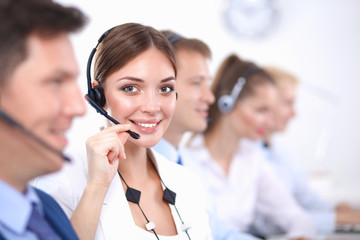 Attractive Smiling positive young businesspeople and colleagues in a call center office