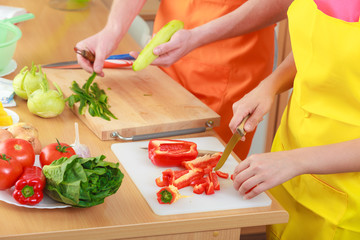 Couple preparing fresh vegetables salad. Diet