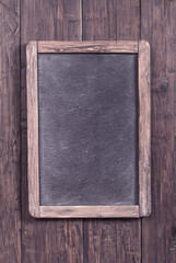 Fototapeta premium Rustic menu blackboard on wooden wall
