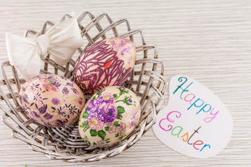 Fototapeta na wymiar Decorated Easter eggs in a basket