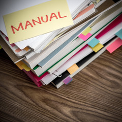 Manual; The Pile of Business Documents on the Desk