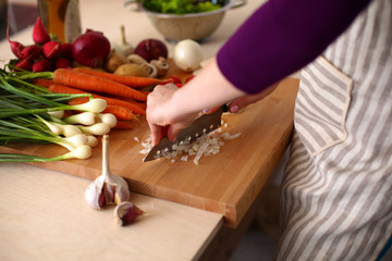 Young Woman Cooking in the kitchen. Healthy Food