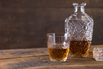 whiskey in glass on wood background