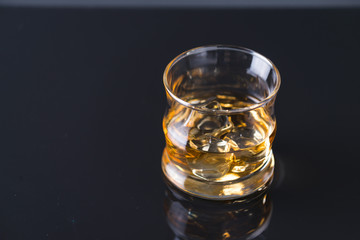 whiskey on the rocks on glass table