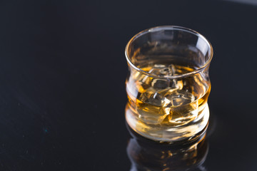 whiskey on the rocks on glass table