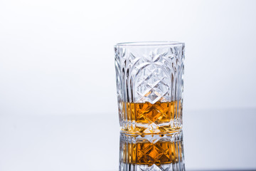 whiskey on the rocks on glass table