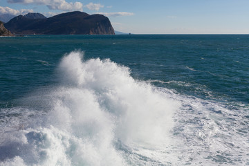 Stone breakwater with breaking waves.