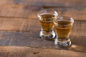 whiskey in glass on wood background