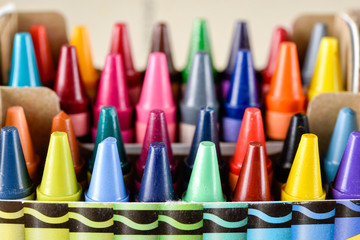 Crayons stacked on art material