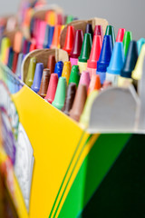 Crayons stacked on art material - 103294358