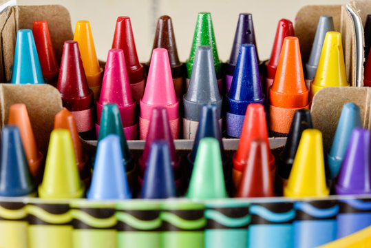 Crayons stacked on art material