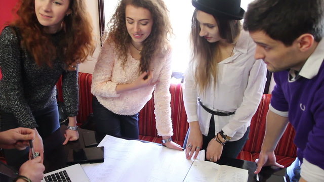 creative people working together on paperwork 