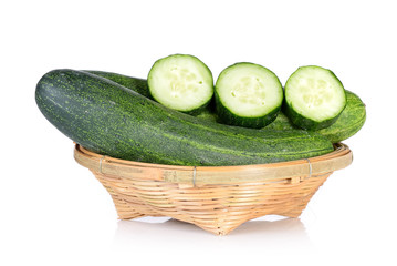 fresh cucumbers in basket isolated on white background