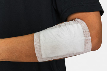 Left arm of a male has been injured on white background