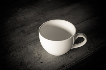 coffee cup in dark tone background