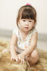 Fototapeta premium Little girl with a big doll