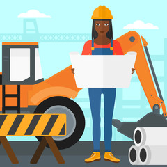 Engineer holding a blueprint.