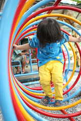 long hair children playing playground