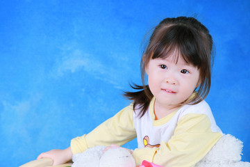 Portrait of little girl with teddy bear