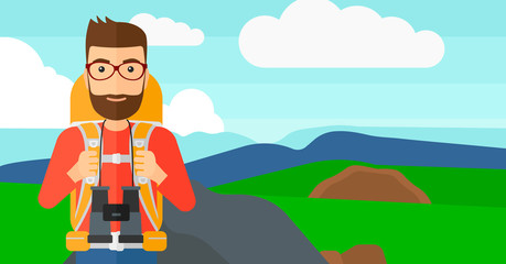 Cheerful backpacker with binoculars.