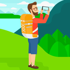 Backpacker taking photo.