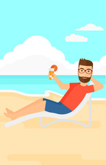 Man sitting in chaise longue.