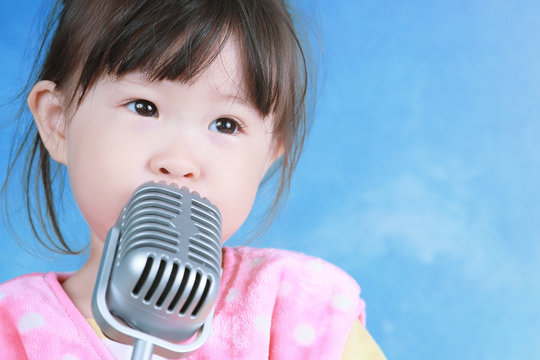 little girl with vintage microphone