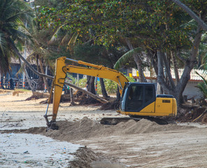 backhoe working on beach