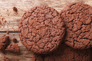 Chocolate cookies cracked macro on the table. horizontal top view 
