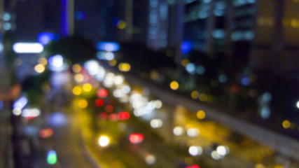 Fototapeta na wymiar Blurred abstract background lights of city street.