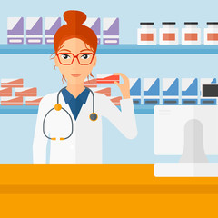 Pharmacist showing some medicine.