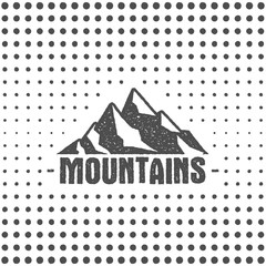 Hand drawn wilderness old style typography poster with retro mountains. Letterpress Print Rubber Stamp Effect. Halftone hand drawn background. Mountain label. Vector vintage mountains badge design