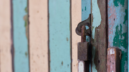 Old key locked of vintage wood.