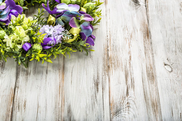 Easter decoration from easter eggs, easter boxwood and flowers.